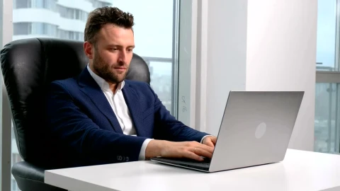 Video Stock Businessman Working On A Laptop At His Desktop Live Wallpaper For PC - Free Live Wallpaper