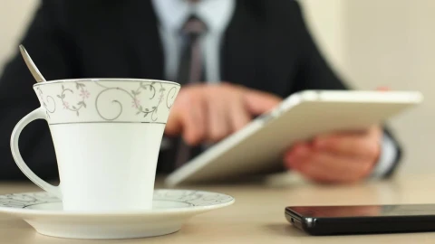 Video Stock Businessman With A Tablet Drinking Coffee Live Wallpaper For PC - Free Live Wallpaper