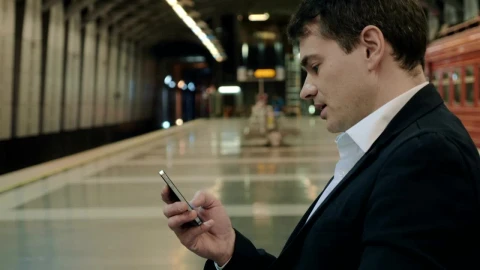 Video Stock Businessman Texting While Waiting In The Subway Live Wallpaper For PC - Free Live Wallpaper