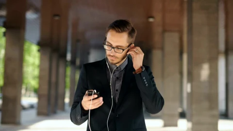 Video Stock Businessman Listen To Music From His Cellphone Live Wallpaper For PC - Free Live Wallpaper