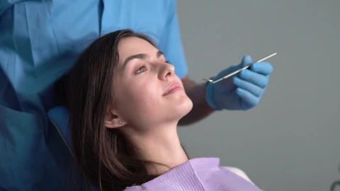 Stock Video Dentist Uses Mirror To Check Patient Teeth Live Wallpaper For PC - Free Live Wallpaper