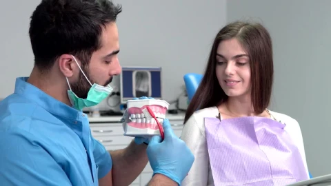 Stock Video Dentist Shows Woman Proper Teeth Brushing Live Wallpaper For PC - Free Live Wallpaper