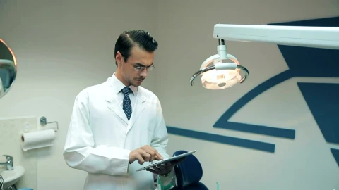 Stock Video Dentist Reviewing Data On His Tablet Live Wallpaper For PC - Free Live Wallpaper