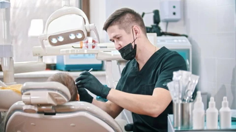Stock Video Dentist In The Distance Attending To A Child Live Wallpaper For PC - Free Live Wallpaper