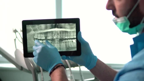 Stock Video Dental Nurse Explains Teeth X Ray On Tablet Live Wallpaper For PC - Free Live Wallpaper