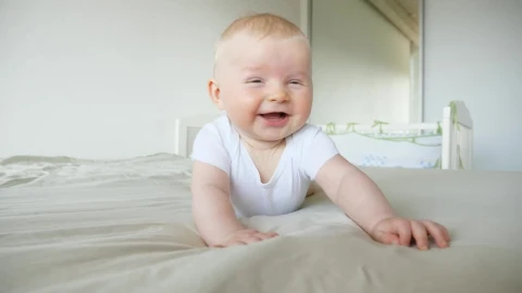 Stock Video Cute Laughing Baby Rolls Over On Bed Live Wallpaper For PC - Free Live Wallpaper
