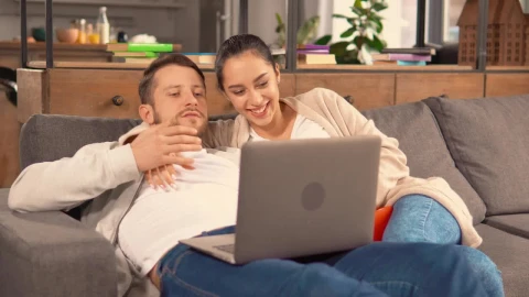 Stock Video Cute Couple Watching A Movie On A Sofa Live Wallpaper For PC - Free Live Wallpaper