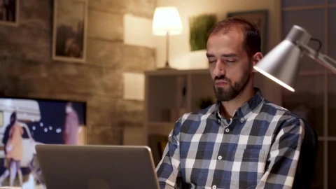Stock Video Creative Man Stops To Think While Working On Laptop Live Wallpaper For PC - Free Live Wallpaper