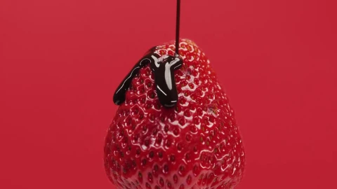Stock Video Cover A Strawberry With Chocolate Syrup On A Red Background Live Wallpaper For PC - Free Live Wallpaper
