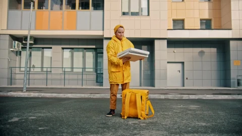 Stock Video Courier Man With Yellow Uniform Opens A Pizza Box Live Wallpaper For PC - Free Live Wallpaper