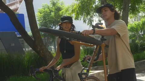 Stock Video Couple With Bikes Walking In A Park Live Wallpaper For PC - Free Live Wallpaper