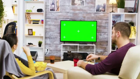 Stock Video Couple Watching Green Screen Tv And Eating Popcorn Live Wallpaper For PC - Free Live Wallpaper