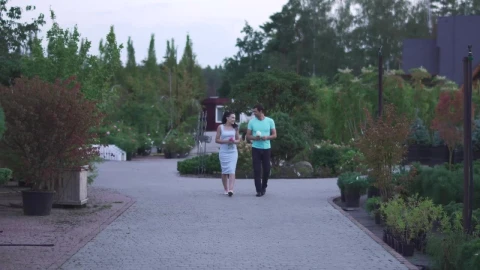 Stock Video Couple Walks In A Garden While Chatting Live Wallpaper For PC - Free Live Wallpaper