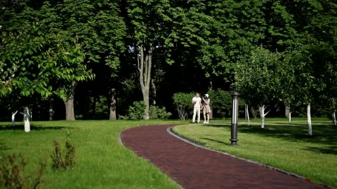 Stock Video Couple Walk In Park Eatng Ice Cream And Holding Hands Live Wallpaper For PC - Free Live Wallpaper