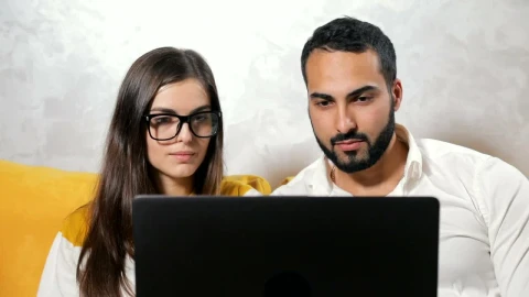 Stock Video Couple Surprised By What They See On Their Laptop Live Wallpaper For PC - Free Live Wallpaper