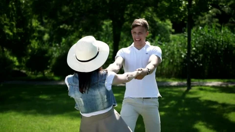 Stock Video Couple Spin Each Other Around In Sunny Park Live Wallpaper For PC - Free Live Wallpaper