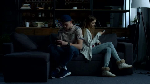 Stock Video Couple Sitting On A Sofa Back To Back Live Wallpaper For PC - Free Live Wallpaper