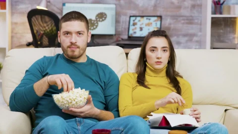 Stock Video Couple Shows Fear While Watching Movie On Sofa Live Wallpaper For PC - Free Live Wallpaper