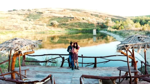 Stock Video Couple Sharing A Drink On A Pier Live Wallpaper For PC - Free Live Wallpaper