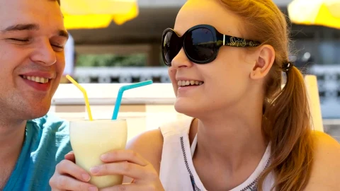 Stock Video Couple Sharing A Drink In The Sun Live Wallpaper For PC - Free Live Wallpaper