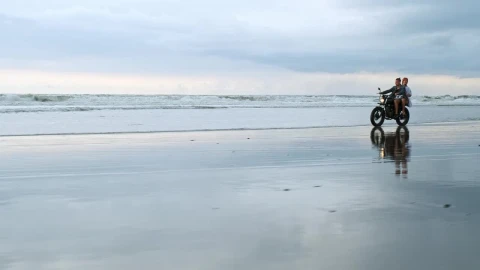Stock Video Couple Riding A Motorcycle On The Beach Live Wallpaper For PC - Free Live Wallpaper