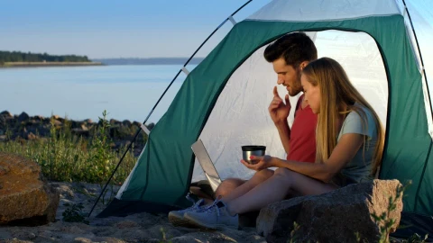 Stock Video Couple Relaxing While Camping At The Lake Live Wallpaper For PC - Free Live Wallpaper