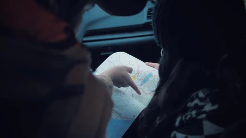 Stock Video Couple Reading A Map Inside A Car Live Wallpaper For PC - Free Live Wallpaper