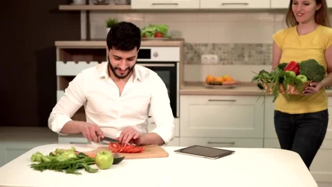 Stock Video Couple Preparing Dinner With Fresh Groceries Live Wallpaper For PC - Free Live Wallpaper