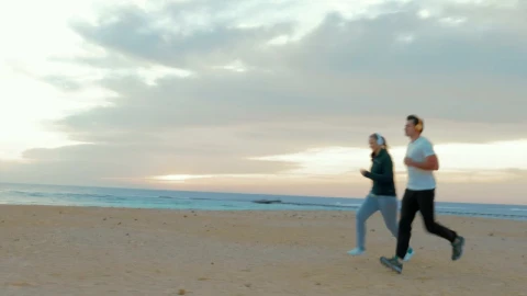 Stock Video Couple Out For A Run On The Beach Live Wallpaper For PC - Free Live Wallpaper