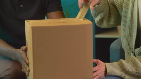 Stock Video Couple Opening A Package With An Alarm Clock Live Wallpaper For PC - Free Live Wallpaper