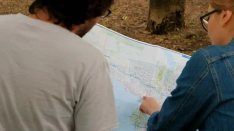 Stock Video Couple Of People Reviewing A Large Map Sitting In A  Smal Live Wallpaper For PC - Free Live Wallpaper