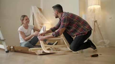 Stock Video Couple Look At Instructions While Assembling Furniture Live Wallpaper For PC - Free Live Wallpaper