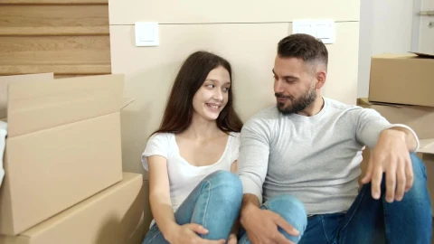 Stock Video Couple In Jeans Cuddle Among Moving Boxes Live Wallpaper For PC - Free Live Wallpaper