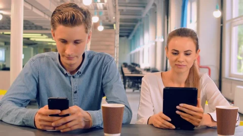 Stock Video Couple In A Cafe Connected On Their Mobile Devices Live Wallpaper For PC - Free Live Wallpaper