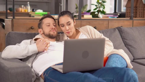 Stock Video Couple Holding Each Other In An Armchair Watching A Movie Live Wallpaper For PC - Free Live Wallpaper