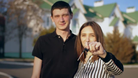 Stock Video Couple Happily Showing Keys To Their New House Live Wallpaper For PC - Free Live Wallpaper