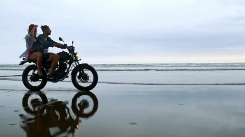 Stock Video Couple Enjoying A Motorcycle Trip On Their Beach Vacation Live Wallpaper For PC - Free Live Wallpaper
