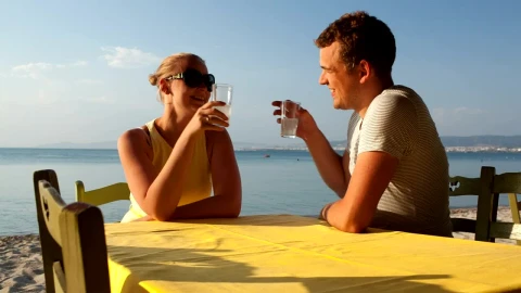 Stock Video Couple Enjoying A Drink At The Beach Live Wallpaper For PC - Free Live Wallpaper
