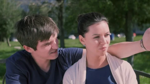 Stock Video Couple Chatting While Sitting In The Park Live Wallpaper For PC - Free Live Wallpaper