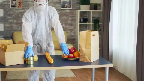 Stock Video Coronavirus Quaratine Grocery Delivery Man Packs Food Live Wallpaper For PC - Free Live Wallpaper