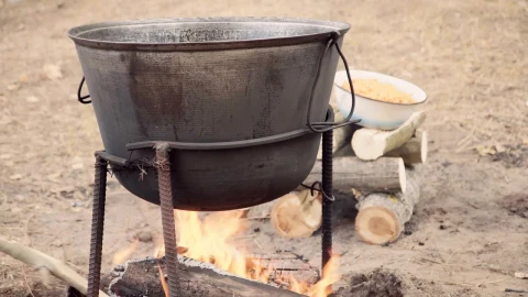 Stock Video Cooking Outdoors With A Cauldron In The Campfire Live Wallpaper For PC - Free Live Wallpaper