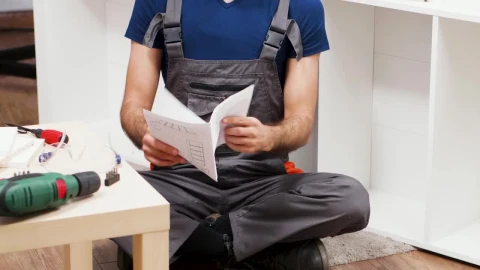 Stock Video Confused Contractor Looks At Instructions And Scratches Head Live Wallpaper For PC - Free Live Wallpaper