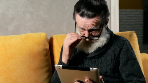 Stock Video Confused Elderly Man Using A Tablet Live Wallpaper For PC - Free Live Wallpaper