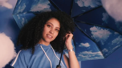 Stock Video Conceptual Portrait Of A Girl With Umbrella With Clouds Live Wallpaper For PC - Free Live Wallpaper