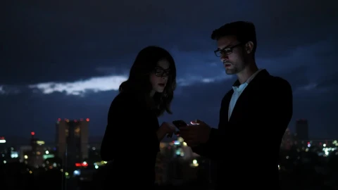 Stock Video Colleagues Looking At Information On Mobile Phone Screen Live Wallpaper For PC - Free Live Wallpaper