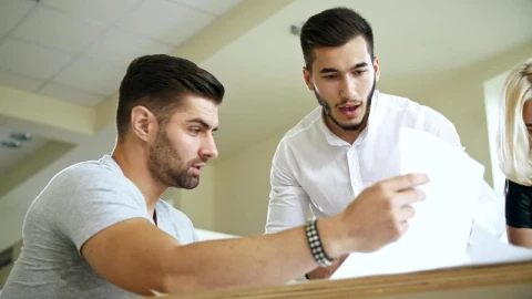Stock Video Co Workers Reviewing A Document Live Wallpaper For PC - Free Live Wallpaper