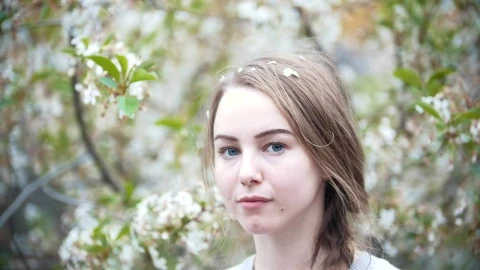 Stock Video Face Of A Young Woman With A Flowering Tree Behind Live Wallpaper For PC - Free Live Wallpaper