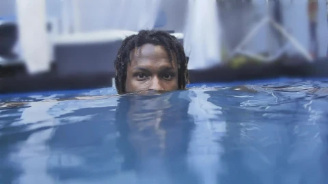 Stock Video Face Of A Man Leaning Out While He Floats On Live Wallpaper For PC - Free Live Wallpaper