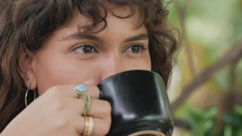 Stock Video Face Of A Girl Drinking Coffee While She Listens To Live Wallpaper For PC - Free Live Wallpaper