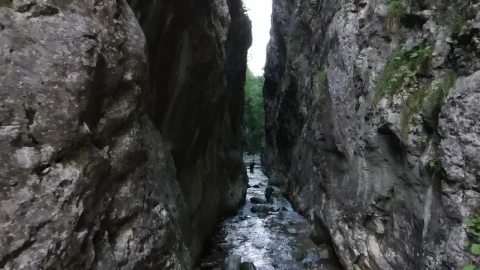 Stock Video Explorers Crossing A River Between Two Mountains Live Wallpaper For PC - Free Live Wallpaper